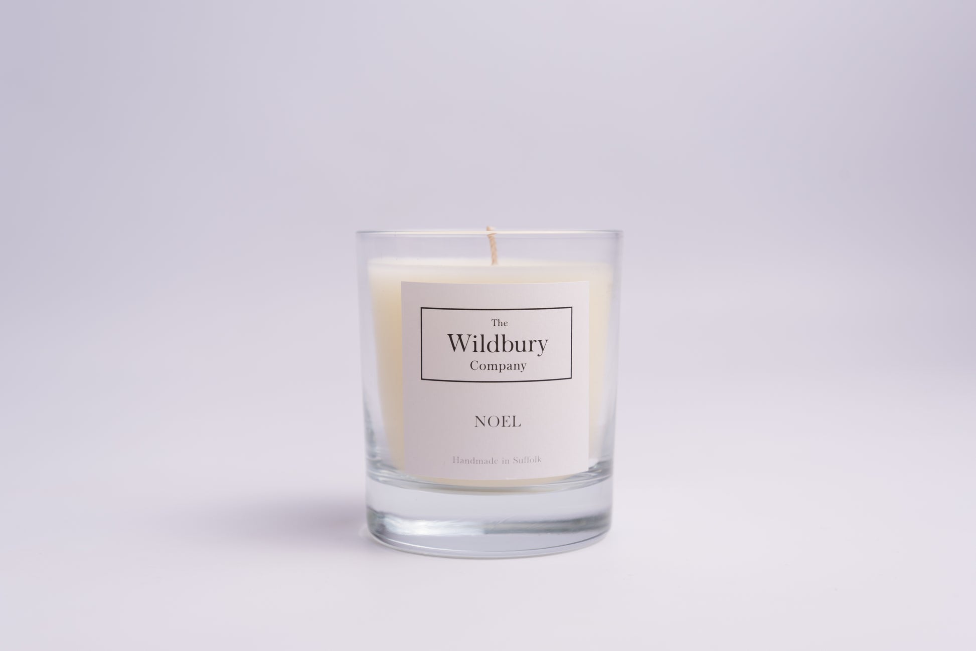 One Wick Candle in Glass with white label. 