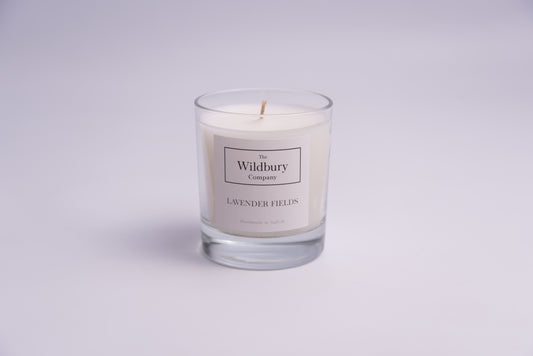 Single wick Lavender Fields Candle in Glass with white wax and a label